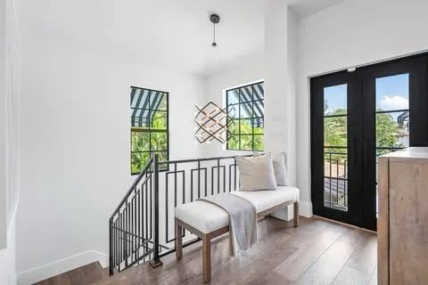 Interior loft guardrail beside french doors