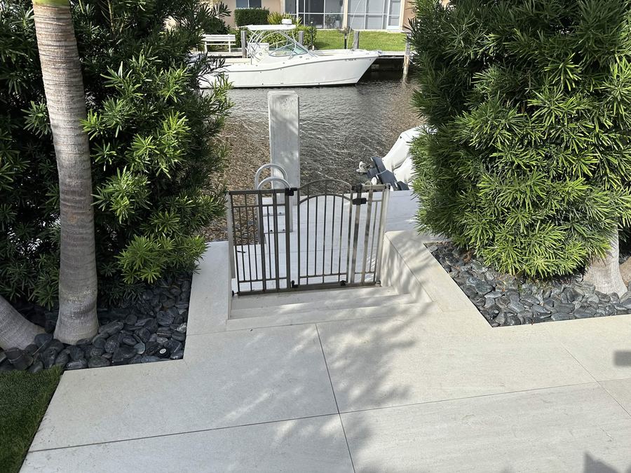 Metal gate and railing at a waterfront dock walkway